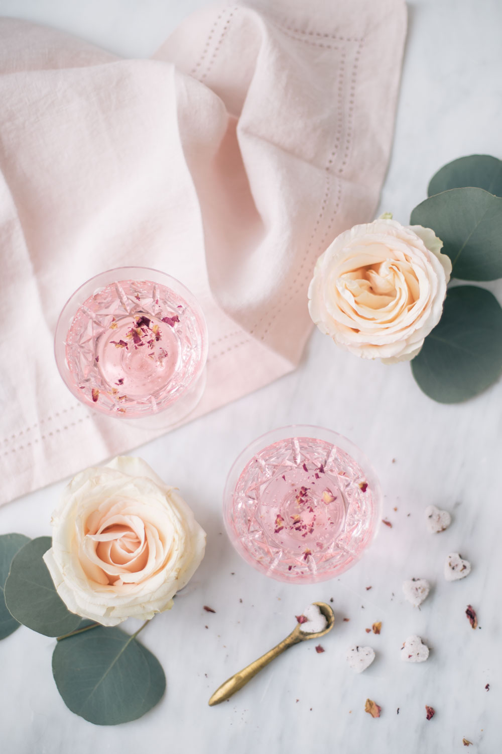 rose water cocktail. pink cocktail. how to make a rose cocktail. rose infused cocktail. pink linen napkin from williams sonoma